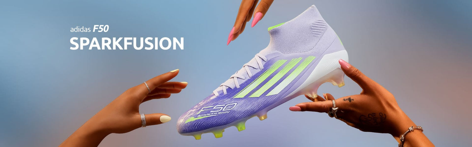 Adidas soccer shoe with 'adidas F50 Sparkfusion' text held by two hands against a blurred background