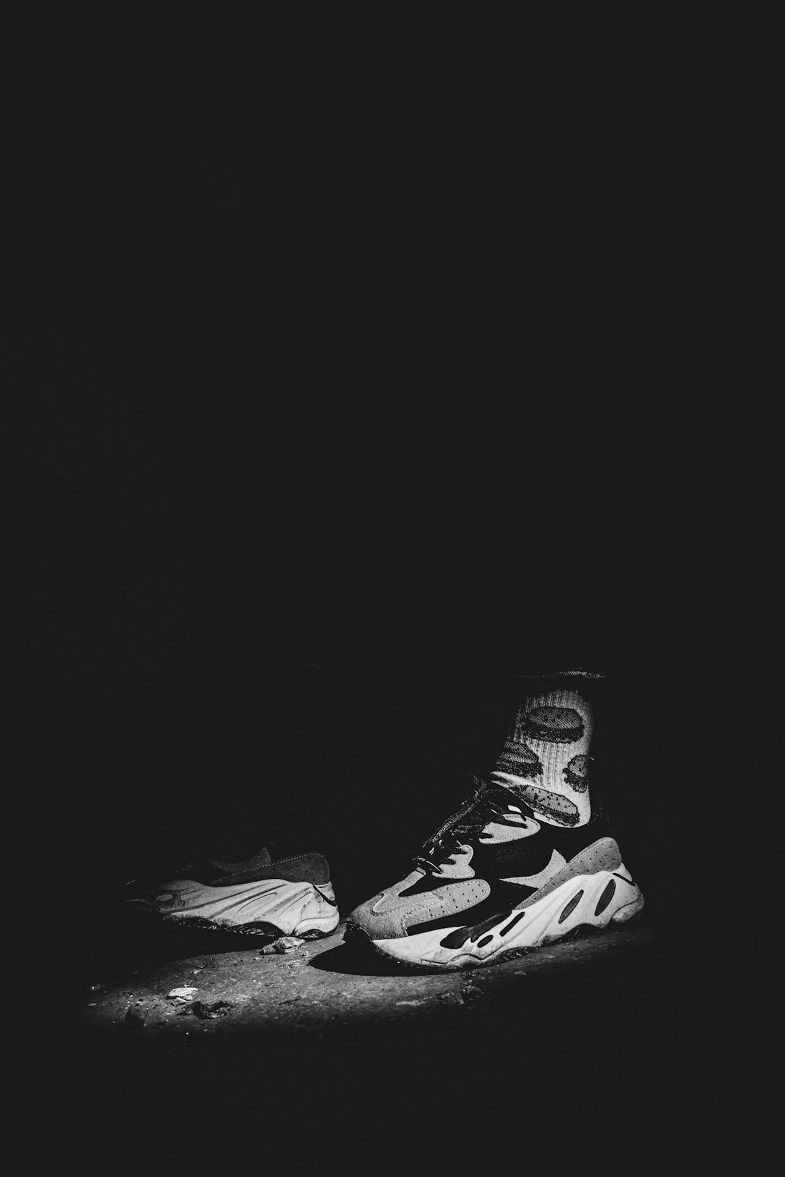 A black and white photo of a pair of sneakers