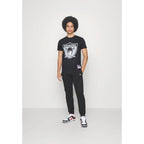 Mitchell &amp; Ness NFL Oakland Raiders Team Logo Tee BMTRINTL1270-ORABLCK Clothing/Lifestyle/T-shirts/Mitchell & Ness Your Sports Performance