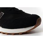 New Balance women’s 515 black suede leather sneakers