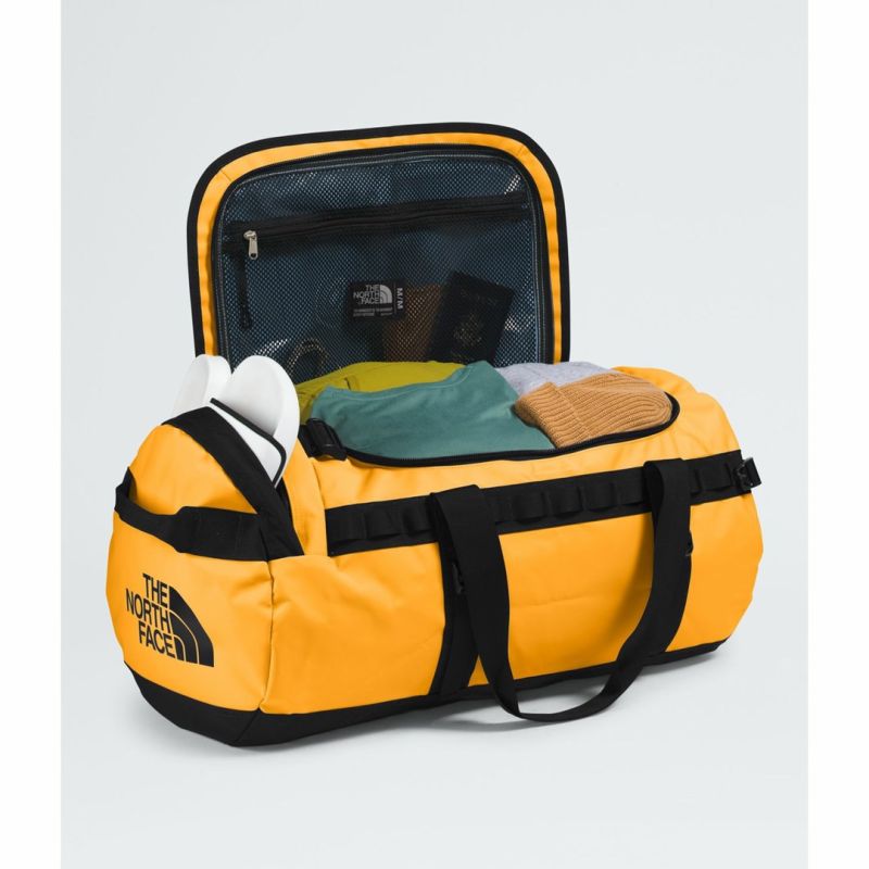 Base camp duffel bag m-summit gold-tnf black-npf THE NORTH FACE Bagaż/Walizki, torby, worki Your Sports Performance